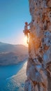 Rock climber ascending a challenging cliff face Royalty Free Stock Photo