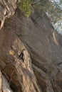 Rock climber ascending a rope.