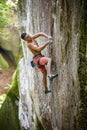 Rock climber on challenging route on vertical cliff Royalty Free Stock Photo