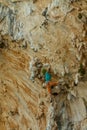 Rock climber on tufas climbing route in Kalymnos, Greece