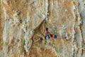 Rock climber on tufas climbing route in Kalymnos, Greece