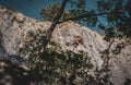 Rock climber climbing high mountains in Crni Kal Slovenia