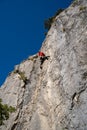 Rock climber climbing high mountains in Crni Kal Slovenia