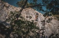 Rock climber climbing high mountains in Crni Kal Slovenia