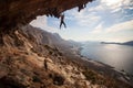 Rock climber climbing at the rock at sunset Royalty Free Stock Photo