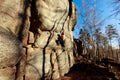 Rock climber climbs a boulder over a rock without insurance