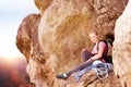 Rock climber enjoying the view on top of mountain