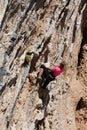 Sport rock climber on handholds on challenging route on cliff Royalty Free Stock Photo