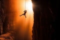 rock climber hangs on a rope in a deep abyss, the sunlight filtering through the rocks as they display their strength