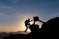 Rock climber helping another