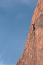 Rock climber high on cliff Royalty Free Stock Photo