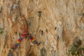Rock climber lead climbing on challenging overhanging climbing route on tufa rocks
