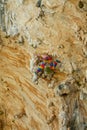 Rock climber lead climbing on challenging overhanging climbing route on tufa rocks