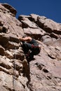 Rock climber nearing top