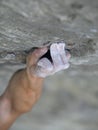 Rock climber's hand on handhold Royalty Free Stock Photo