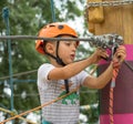 A rock climber tie a knot on a rope. A person is preparing for the ascent. The child learns to tie a knot. Checking the insurance Royalty Free Stock Photo