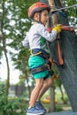 A rock climber tie a knot on a rope. A person is preparing for the ascent. The child learns to tie a knot. Checking the insurance Royalty Free Stock Photo