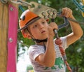 A rock climber tie a knot on a rope. A person is preparing for the ascent. The child learns to tie a knot. Checking the insurance