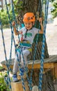 A rock climber tie a knot on a rope. A person is preparing for the ascent. The child learns to tie a knot. Checking the insurance Royalty Free Stock Photo