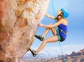 Rock climber trying to reach top of the mountains Royalty Free Stock Photo