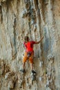 Rock climber on tufas climbing route in Kalymnos, Greece Royalty Free Stock Photo