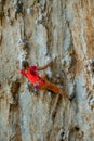 Rock climber on tufas climbing route in Kalymnos, Greece