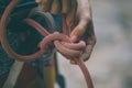 Rock climber tying a safety knot Royalty Free Stock Photo