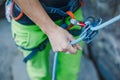 Rock climber wearing safety harness and climbing equipment outdoor Royalty Free Stock Photo