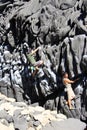 Rock climbers bouldering around the Concon coastline