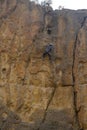 Rock climbers climb a large rock, filmed from the back Royalty Free Stock Photo