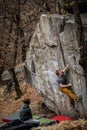 Rock climbers climbing on a boulder rock