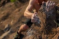 Rock climbing abstract, hand and leg of the climber shoot from a Royalty Free Stock Photo