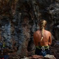 Rock climbing girl in Railay, Krabi, Thailand