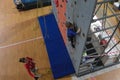 Russia, Saratov - march, 2020: Rock climbing. Kid climbs on the training wall on the climbing gym. Child climbs