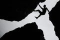 Rock climbing,Man climb between three rock on the cliff. Royalty Free Stock Photo