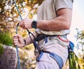 Rock climbing, mountain and man with rope and harness for adventure, freedom and extreme sports in nature. Fitness Royalty Free Stock Photo