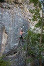 Rock climbing on natural terrain.