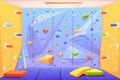 Rock climbing wall with grips, mats and ropes