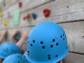 Children wearing blue climbing helmets on a climbing wall Royalty Free Stock Photo