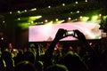 Rock concert, silhouettes of happy people raising up hands Royalty Free Stock Photo