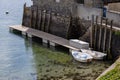 Two rowing boats moored at the Rock Sailing Club in Rock, Cornwall on June 12, 2023