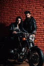 Rock couple. rock couple with motorcycle. rock couple travel on motorbike. rock couple in leather jacket.