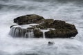 Rock covered in sea water after a wave cradhed on it at Pancake rocks, New Zealand Royalty Free Stock Photo