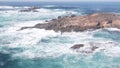 Rock crag of cliff, ocean beach, Point Lobos, California coast. Waves crashing.