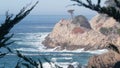 Rock crag of cliff, ocean beach, Point Lobos, California coast. Waves crashing. Royalty Free Stock Photo