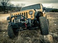 Orange Jeep Rock Crawling Royalty Free Stock Photo