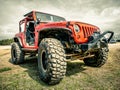 Orange Jeep Rock Crawling Royalty Free Stock Photo