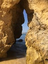 Rock crevice opening in Lagos, Portugal beach Royalty Free Stock Photo