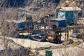 Rock crusher machine, crushing machinery, conveying crushed granite gravel stone in a granite quarry Royalty Free Stock Photo