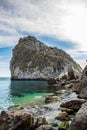 Rock Diva on beach, beautiful black sea shore landscape with mountain cliff, main nature landmark in Crimean Simeiz